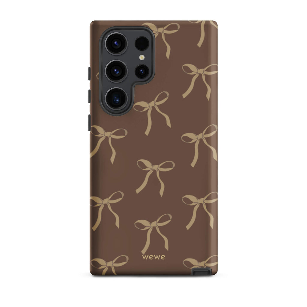 Custom samsung galaxy s23 ultra tough case in matte dark espresso brown featuring an all-over repeating pattern of light taupe/tan ribbons/bows, with 'wewe' branding at the bottom.