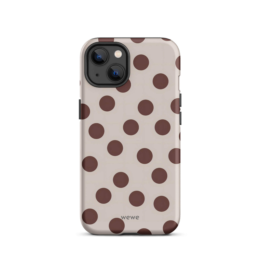 Custom iPhone 13 tough case in matte light beige/taupe with large dark brown (mocha) polka dots and 'wewe' branding at the bottom.