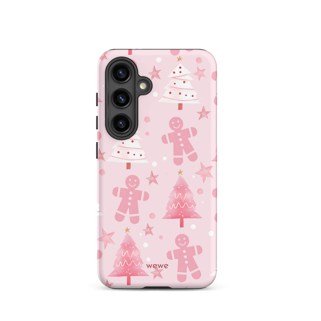 Custom samsung galaxy s24 tough case featuring a soft pastel pink background with a scattered pattern of pink gingerbread men, pink and white Christmas trees, and watercolor pink stars, with 'wewe' branding at the bottom.