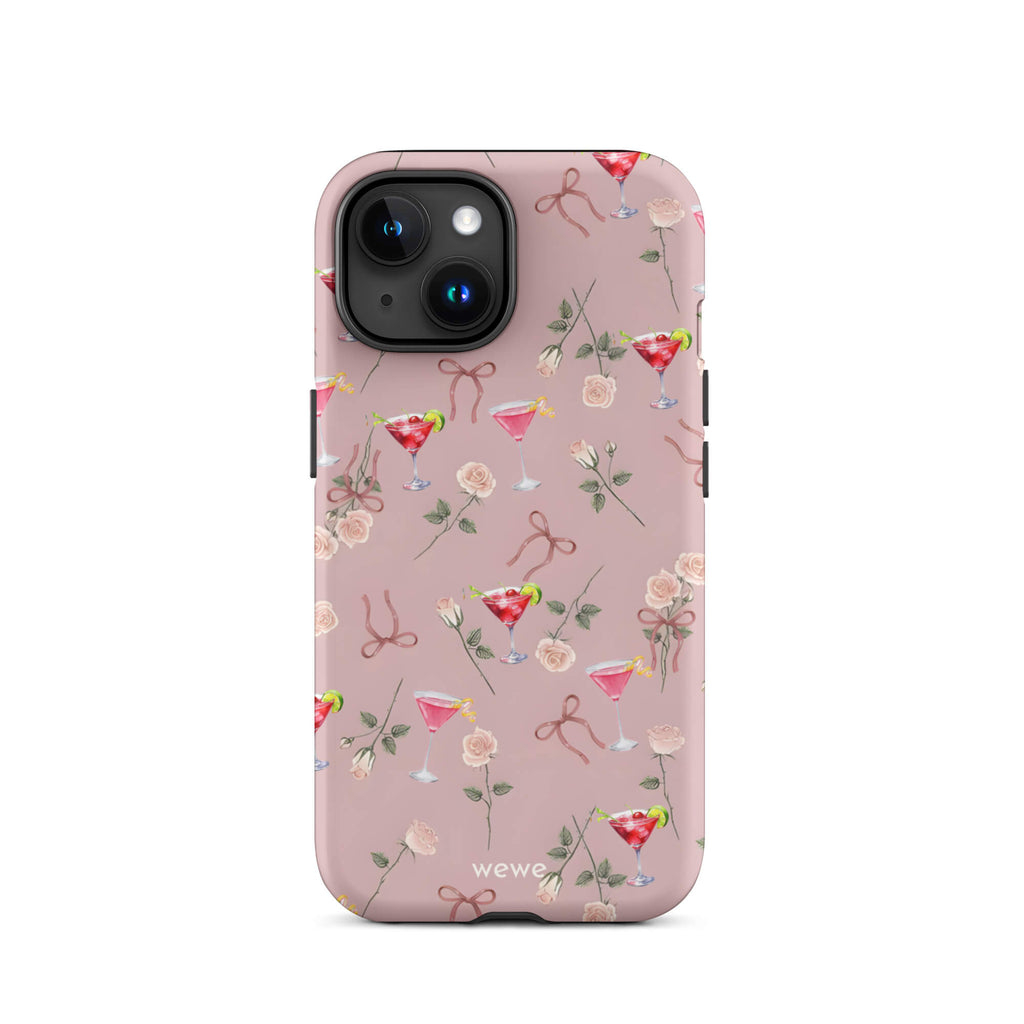 Custom iPhone case 15 with a repeating pattern of pink roses, ribbon bows, and red cocktail glasses on a light rose colour background.