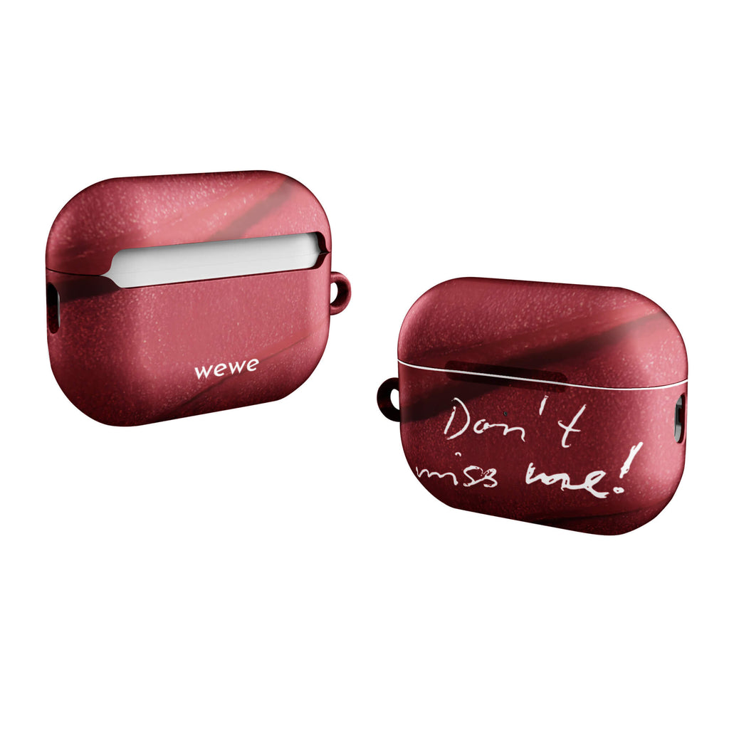 Custom airpods case pro gen2 with a deep red, textured lipstick smudge design and the handwritten text "Don't miss me!".