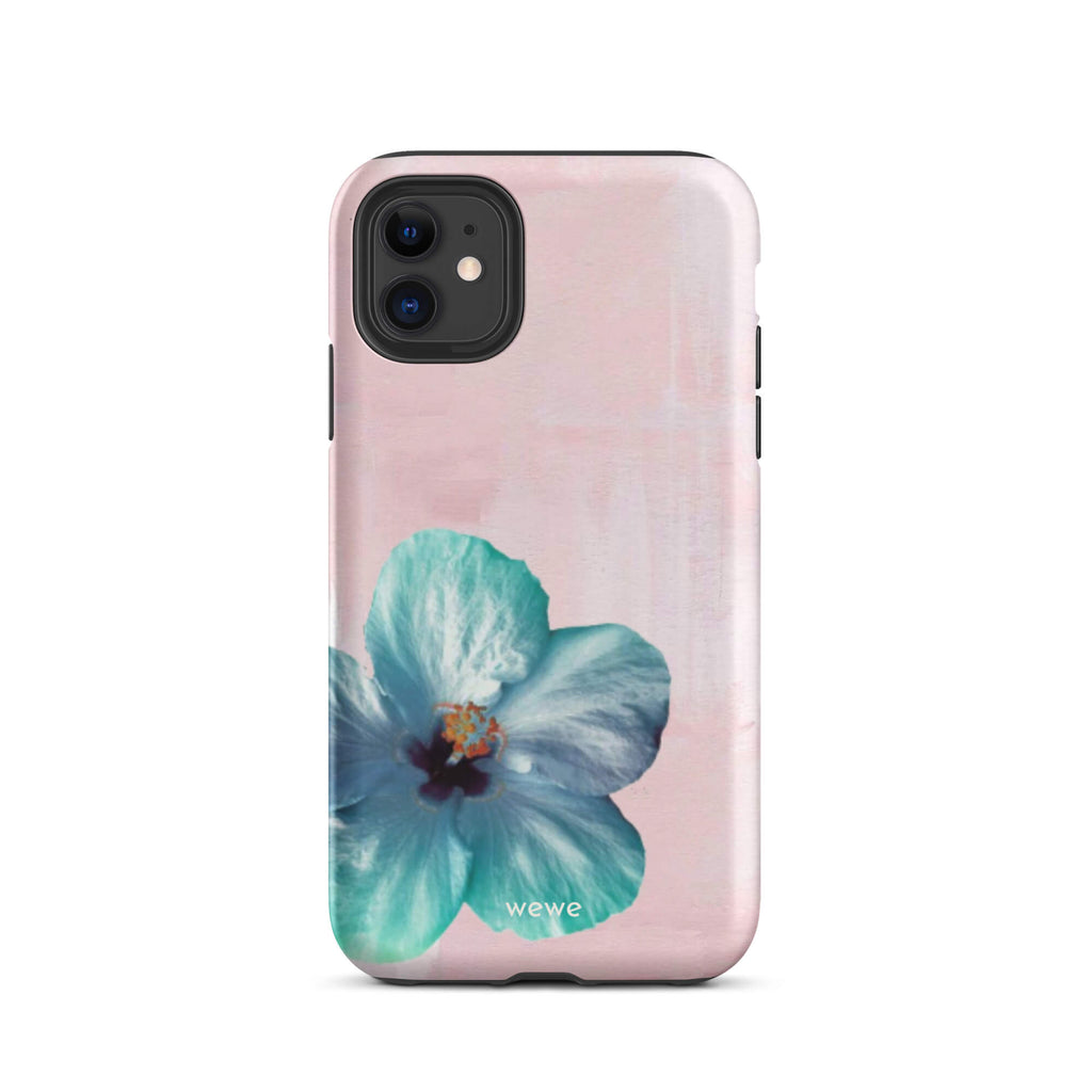 Custom iPhone case 11 with a photo of a blue hibiscus flower with a green center on a soft pink painted 