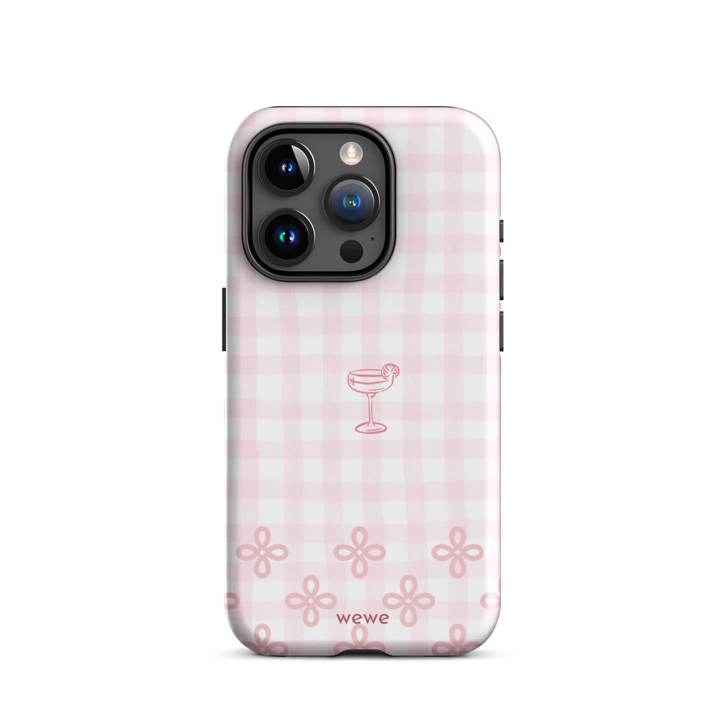 Custom iPhone case 15 pro with pink and white gingham checkered pattern, cocktail glass illustration, and ribbon designs.