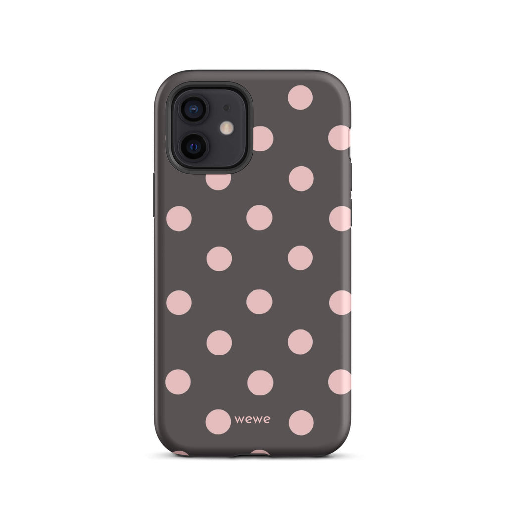 Custom iPhone 12 tough case in matte dark grey/charcoal with large light pink (blush) polka dots and 'wewe' branding at the bottom.