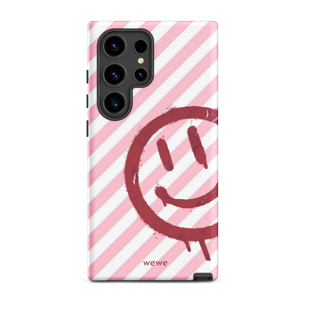 Custom samsung galaxy s24 ultra  Phone case with a pink and white diagonal stripe background and a red spray paint graffiti smiley face.