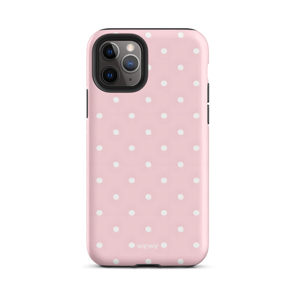 Custom iPhone case 11 pro with a soft pink background and a pattern of small white polka dots.