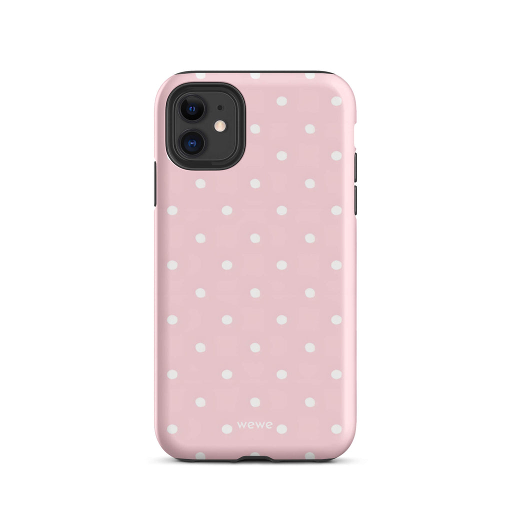 Custom iPhone case 11 with a soft pink background and a pattern of small white polka dots.