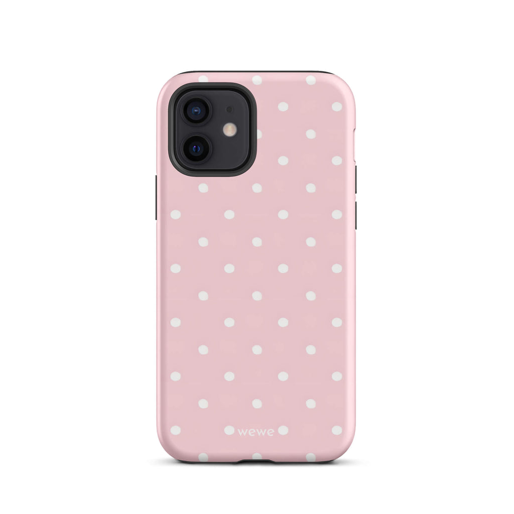Custom iPhone case 12 with a soft pink background and a pattern of small white polka dots.