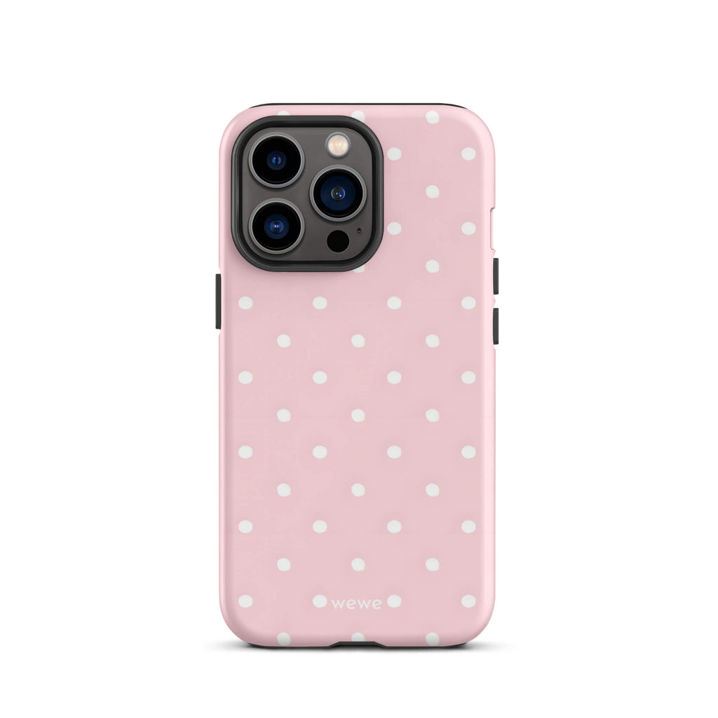 Custom iPhone case 13 pro with a soft pink background and a pattern of small white polka dots.