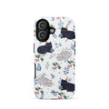 Custom iPhone case 17 with a cute pattern of black and gray cats wearing party hats, cherries, and floral sprigs on a white background.