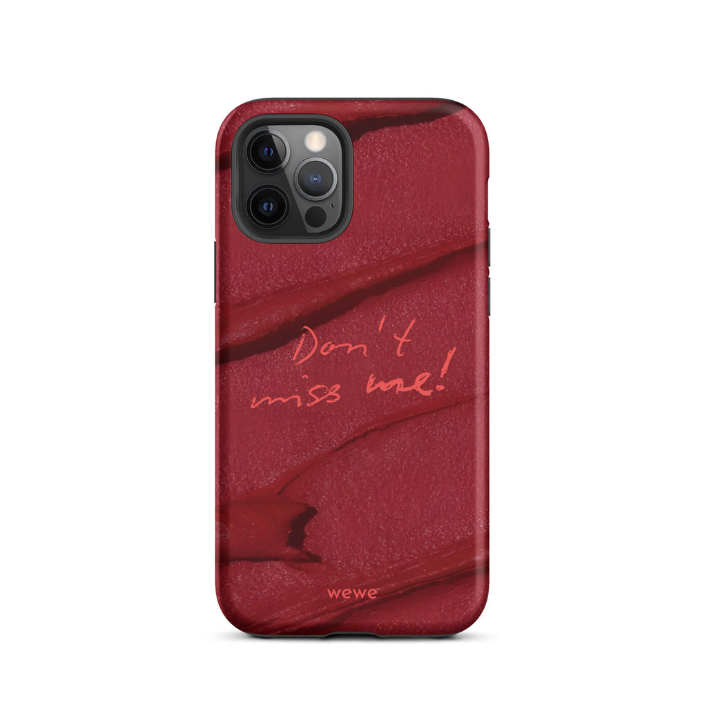 Custom iPhone case 12 pro with a deep red, textured lipstick smudge design and the handwritten text "Don't miss me!".